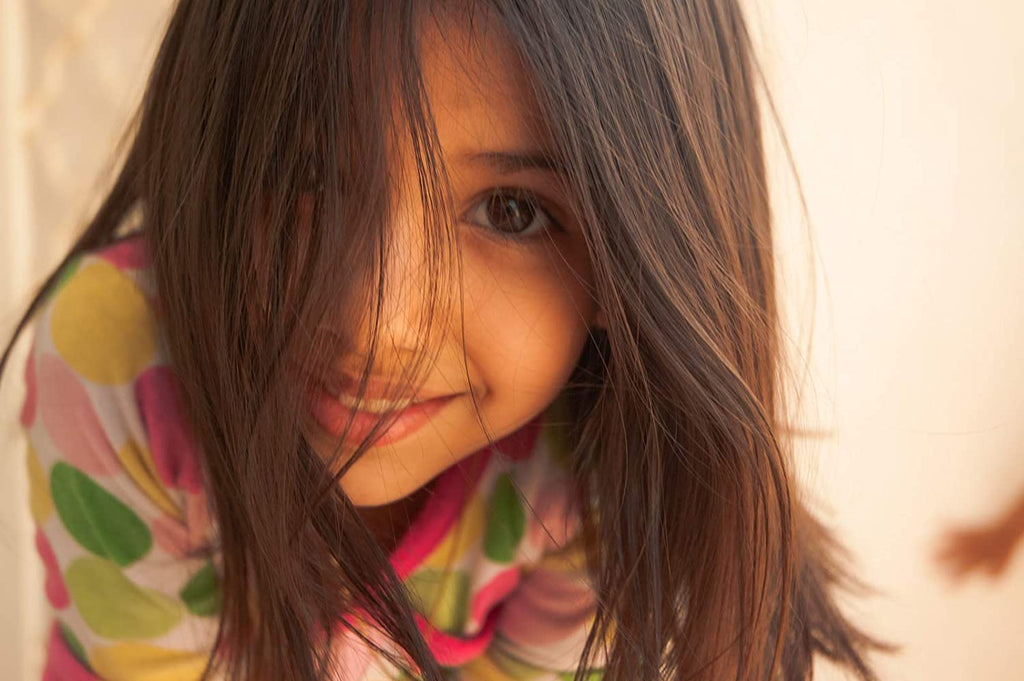 Female_Child_With_LongHair_Looking_At_Camera